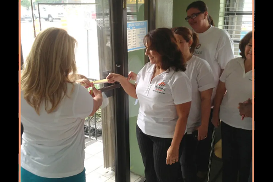 Heartbeat of Miami team members at a clinic door