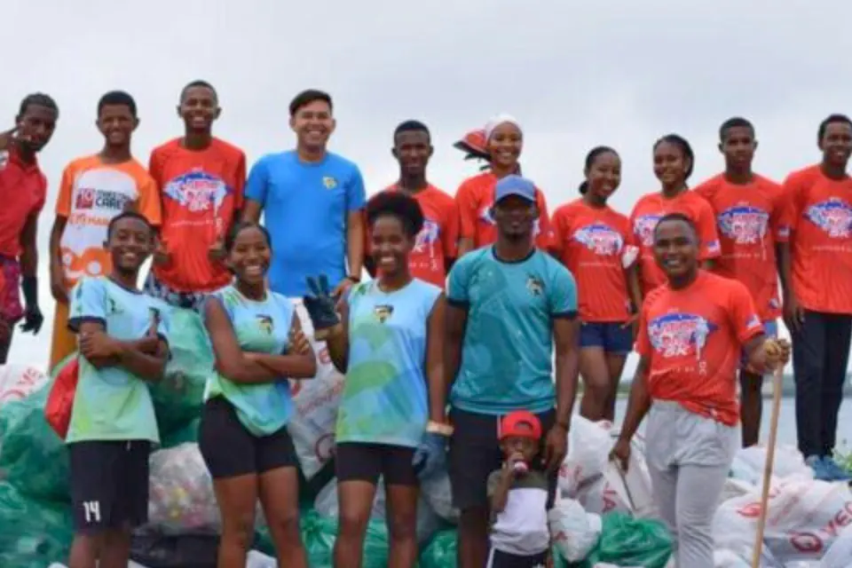Young people from a Leaders Unlimited service project with the bags of trash they collected