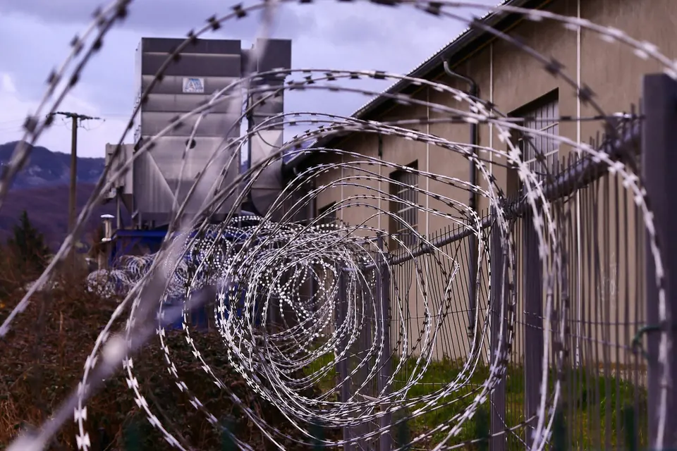 Razor wire along a prison fence