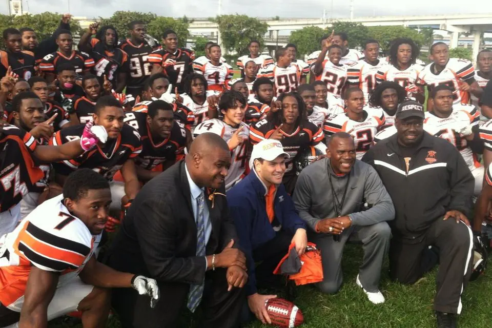 The Booker T. Washington Senior High football team with its coaches