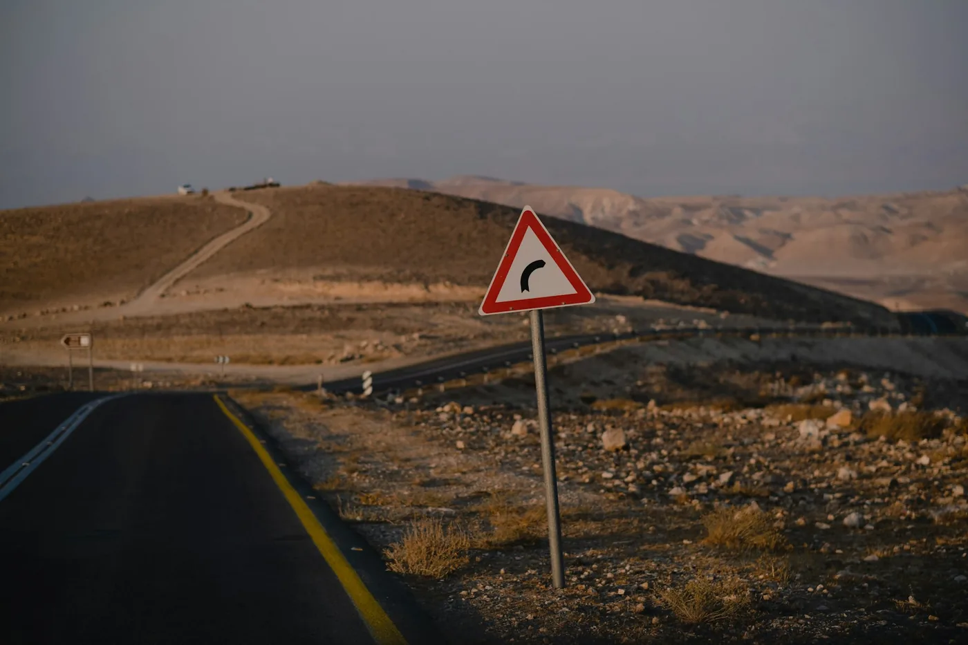 An empty road running through the Negev desert in Israel.