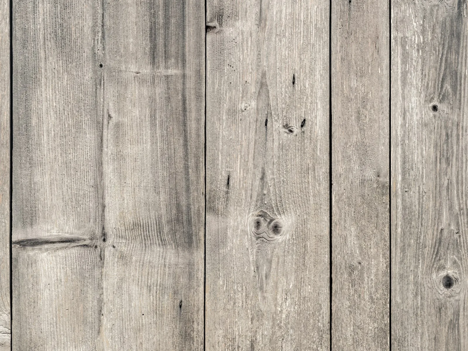 Weathered gray wooden planks, like the timbers of a boat