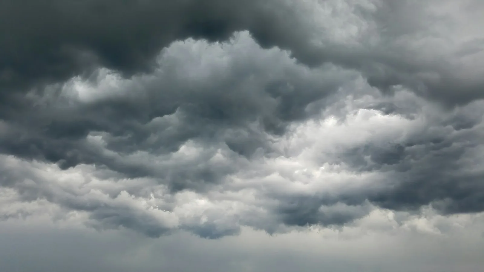 Dense, dark storm clouds filling the whole sky.